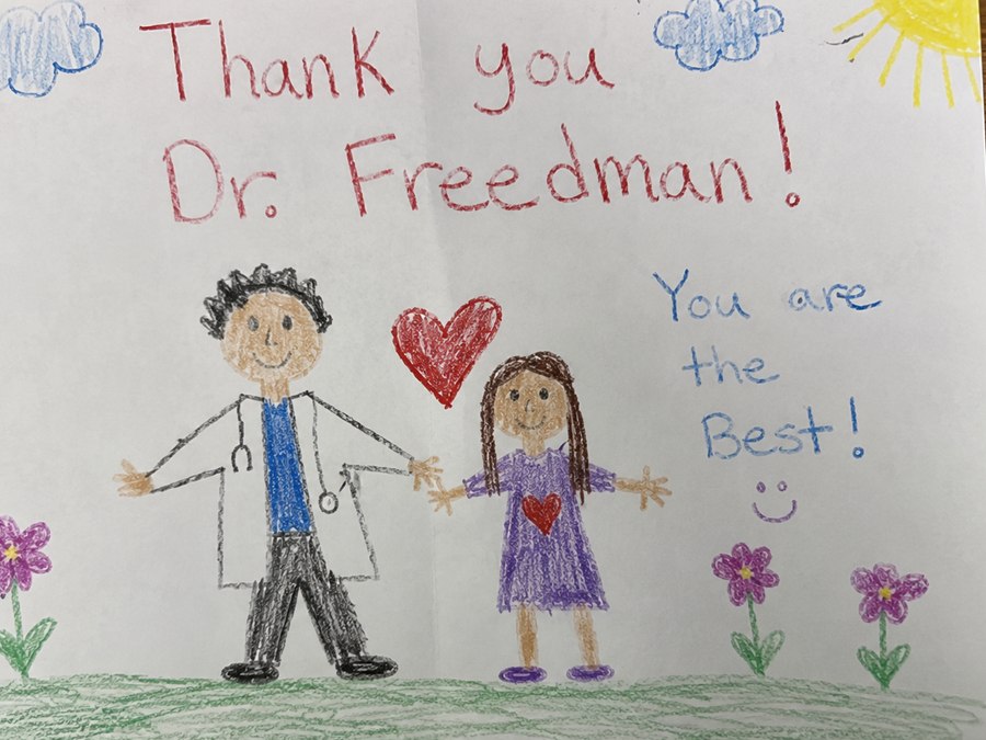 A young patient's hand-drawn thank-you card that reads 'Thank you Dr. Freedman! You are the best!'